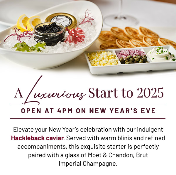 Elevate your New Year's celebration with our indulgent Hackleback caviar. Served with warm blinis and refined accompaniments, this exquisite starter is perfectly paired with a glass of Schramsberg sparkling wine.